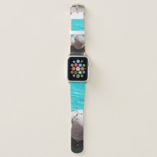 Woman sitting beside swimming pool apple watch band