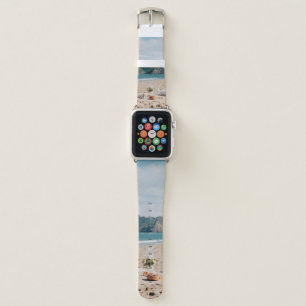 Woman sitting near seashore while looking at Golde Apple Watch Band