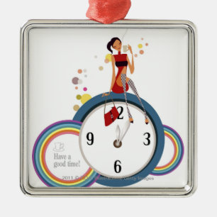Woman sitting on a clock and holding a tea cup metal ornament