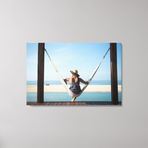 Woman Sitting On A Hammock At A Small Hotel Canvas Print