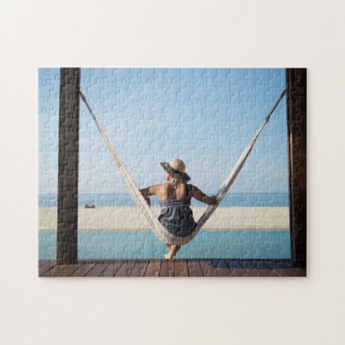 Woman Sitting On A Hammock At A Small Hotel Jigsaw Puzzle