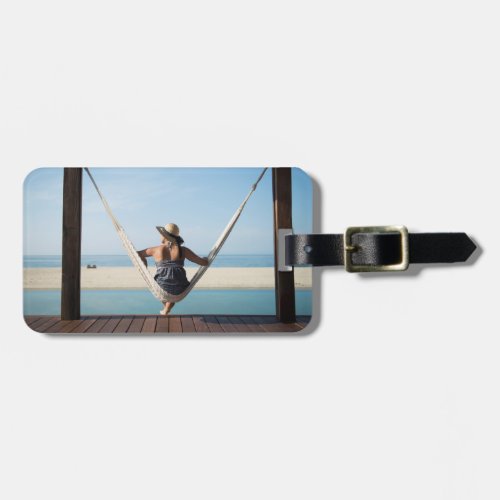 Woman Sitting On A Hammock At A Small Hotel Luggage Tag