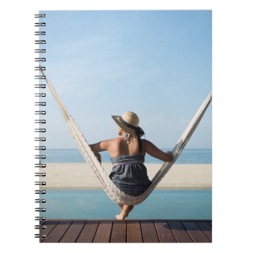 Woman Sitting On A Hammock At A Small Hotel Notebook