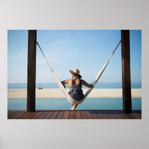 Woman Sitting On A Hammock At A Small Hotel Poster