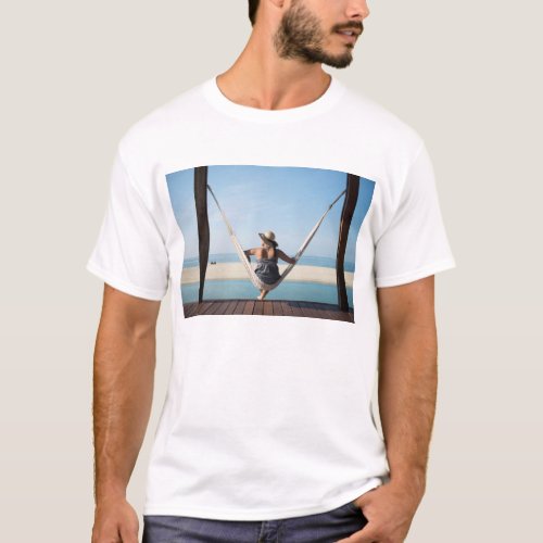 Woman Sitting On A Hammock At A Small Hotel T_Shirt