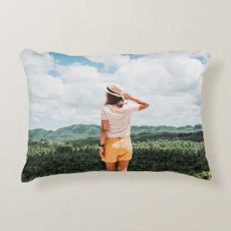 Woman standing near trees accent pillow