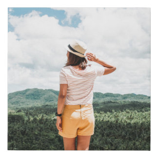 Woman standing near trees faux canvas print