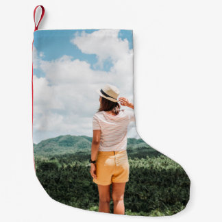 Woman standing near trees small christmas stocking
