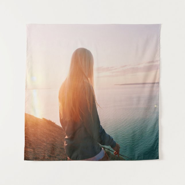 Woman stands near body of water during golden hour tapestry (Front)