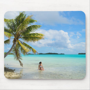 Woman under a palm tree in the Pacific mousepad