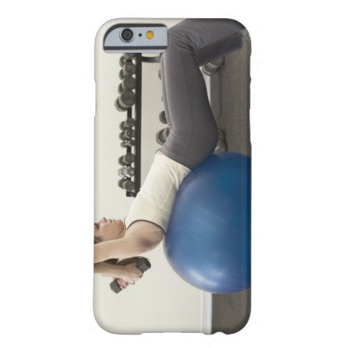 Woman using exercise ball and hand weights barely there iPhone 6 case