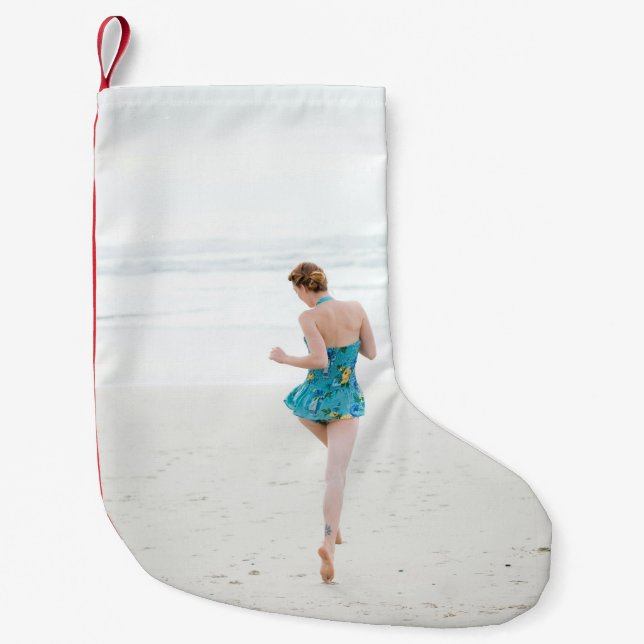Woman walking on shore near beach small christmas stocking (Front)