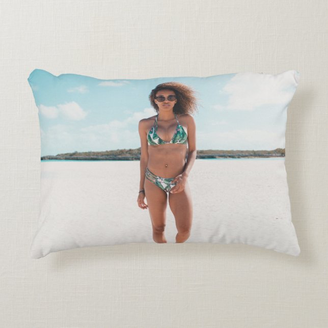 Woman wearing bikini standing on sand accent pillow (Front)