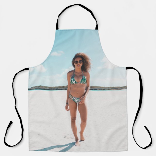 Woman wearing bikini standing on sand apron (Front)