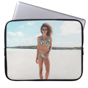 Woman wearing bikini standing on sand laptop sleeve