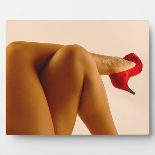 Womans Crossed Bare Legs with Red High Heels Plaque