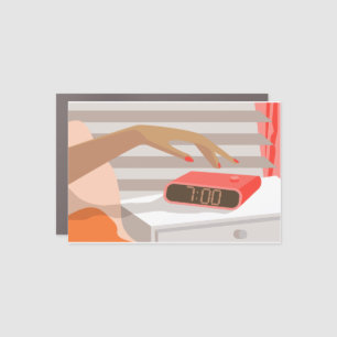 Womans hand pushing on alarm clock snooze button car magnet