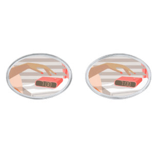 Womans hand pushing on alarm clock snooze button cufflinks
