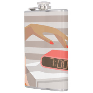 Womans hand pushing on alarm clock snooze button flask