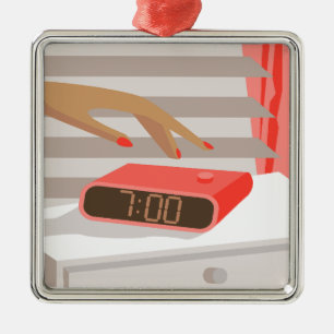 Womans hand pushing on alarm clock snooze button metal ornament
