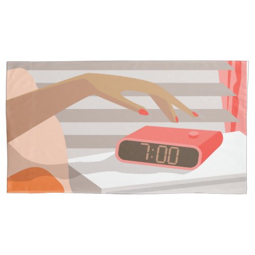 Womans hand pushing on alarm clock snooze button pillow case