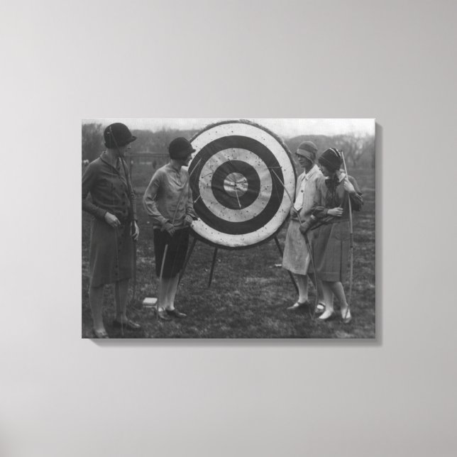 Women examining Archery Target Photograph Canvas Print (Front)