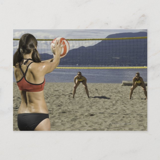 Women playing volleyball on beach postcard (Front)