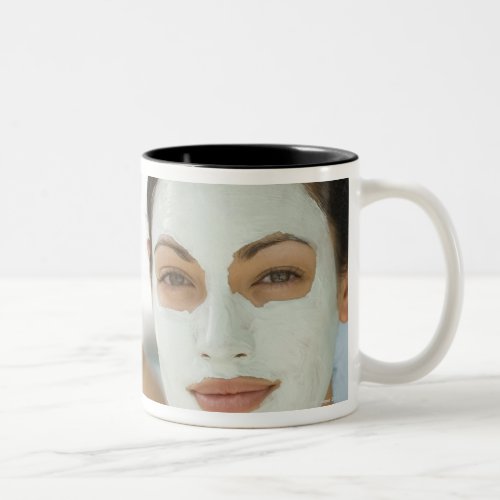 Women smiling in beauty mud masks Two_Tone coffee mug