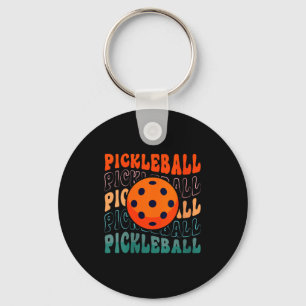 Womens retro pickleball waving style with a pickle keychain