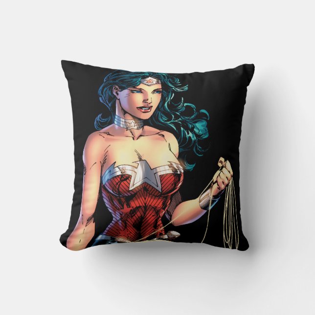 Wonder Woman Gripping Lasso Atop Rock Throw Pillow (Front)