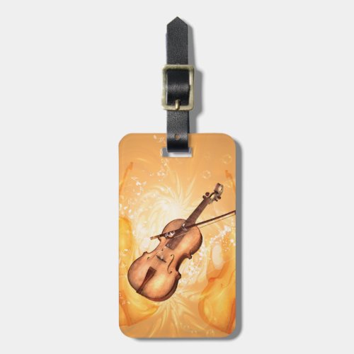 Wonderful violin with violin bow on red background luggage tag