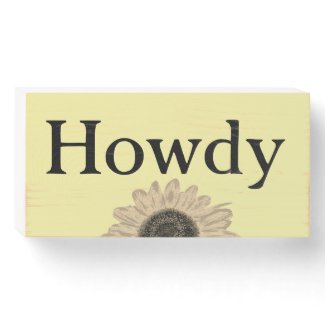 Wood box sign with Howdy greeting and sunflower
