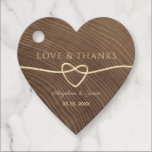 Wood Heart Wedding Thank You Favor Tags<br><div class="desc">Elevate your wedding favors with our rustic wooden heart-shaped thank you tags. Adorned with a delicate gold rope heart and modern script, these tags add a touch of elegance to your heartfelt appreciation. Perfect for adding a rustic charm to your special day, these tags are the perfect finishing touch for...</div>
