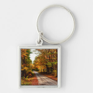 Wood trail with fall foliage keychain