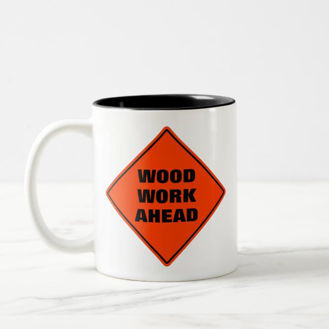 Wood work ahead funny orange caution road sign Two-Tone coffee mug (Left)