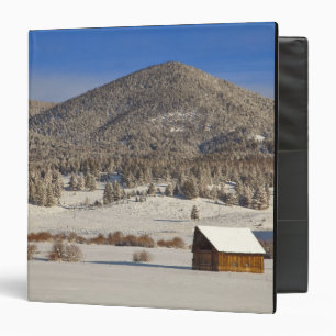 Wooden barn sits in snow near the Boulder Binder