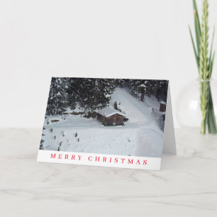 Wooden cabin in the snow view Christmas card