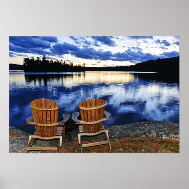 Wooden Chairs At Sunset On Lake Shore Poster (Front)
