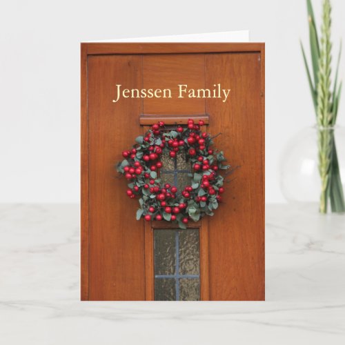 Wooden door with wreath address announcement