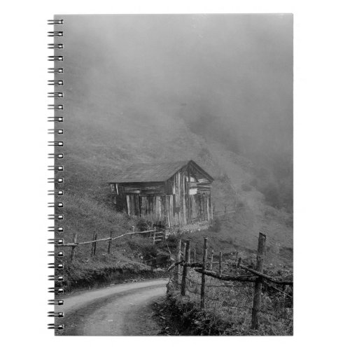 Wooden hut in naturefog at mountain notebook
