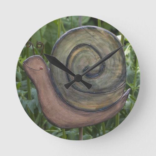 wooden snail in the garden round clock