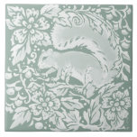 Woodland Sage Green Squirrel Nature Ceramic Tile<br><div class="desc">In restful, natural, pretty tones of sage green, this tile features a cute squirrel exploring a woodland forest with stylized floral and foliage designs. My artwork is inspired by intricate antique chinoiserie pottery and tapestry art, such as William Morris' iconic pieces. This tile would be a beautiful home decor accent...</div>