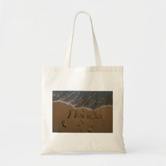 Word Florida in beach sand with wave coming Tote Bag