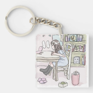 Working at a desk in my room keychain
