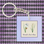 World's Best Mom Irises and Butterfly on Purple Keychain<br><div class="desc">Do you want to show Mom just how great she is? This design features lovely purple and golden irises, a golden butterfly, and the text "World's Best Mom" in purple. The image is bordered in various shades of purple, and you can customize the text if you want. This is a...</div>