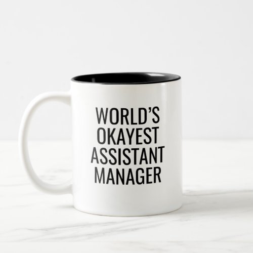 Worlds Okayest Assistant Manager Two_Tone Coffee Mug
