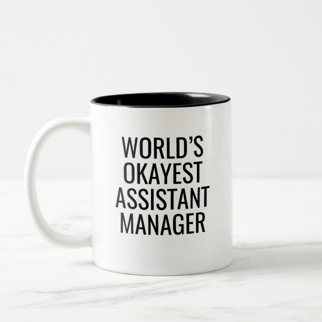 World's Okayest Assistant Manager Two-Tone Coffee Mug (Left)