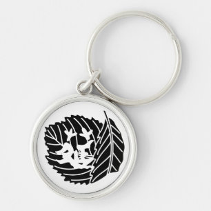 Worm-eaten folded oak leaf crest keychain