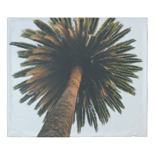 Worm eye photography of palm tree duvet cover