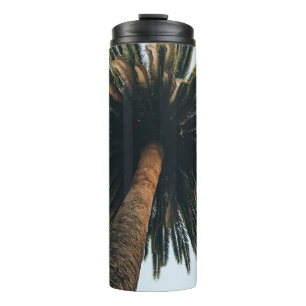 Worm eye photography of palm tree thermal tumbler